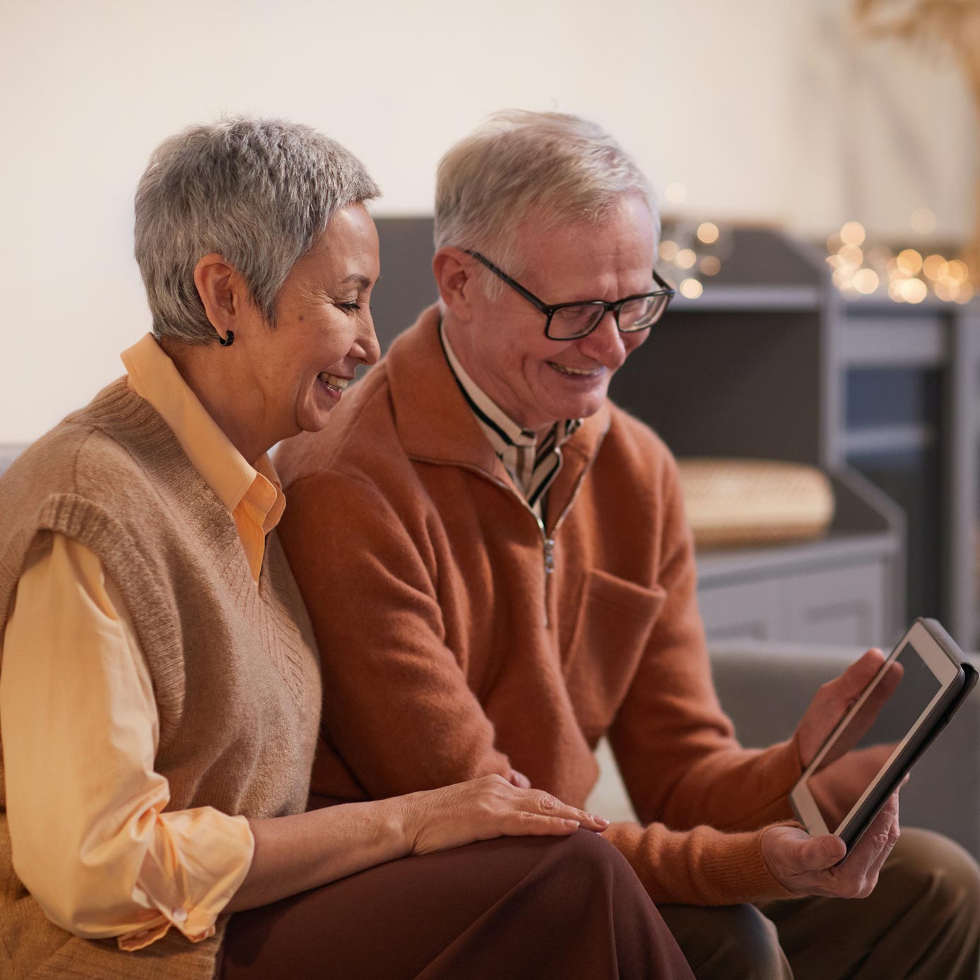 A couple of older adults using Sofi app